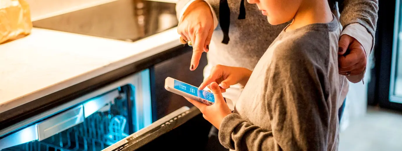 Boy using SMART dishwasher