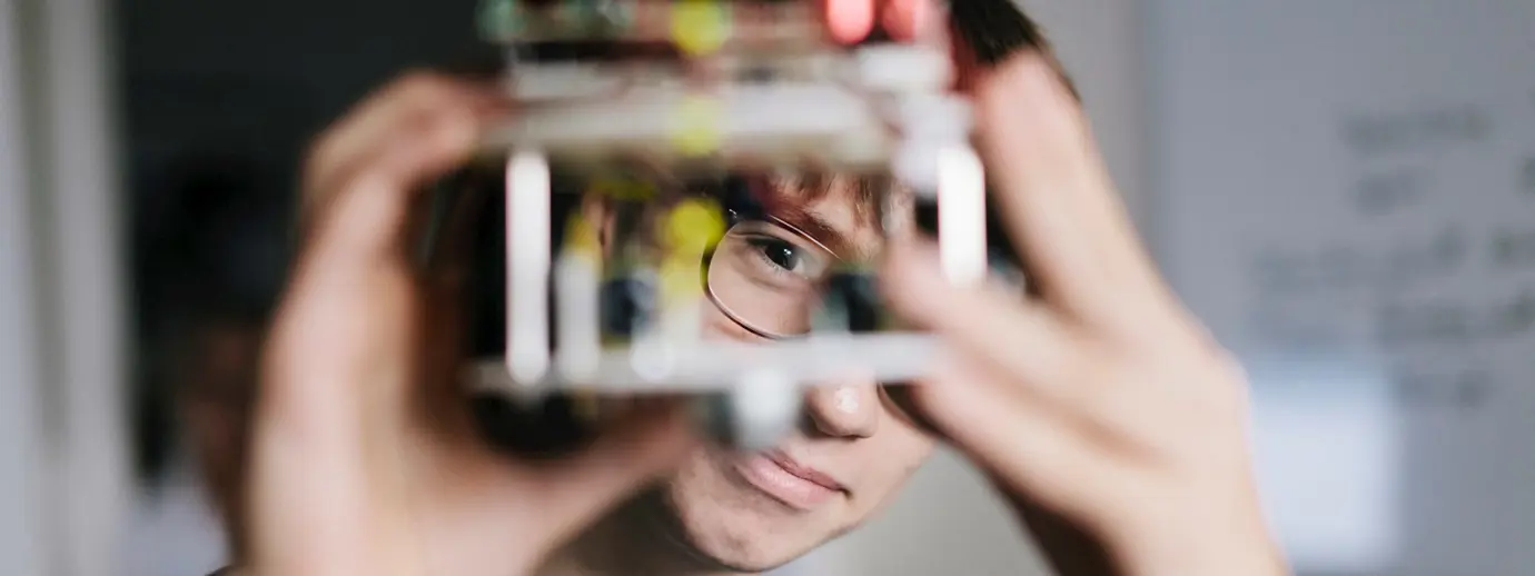 Man looking at electronic machinery