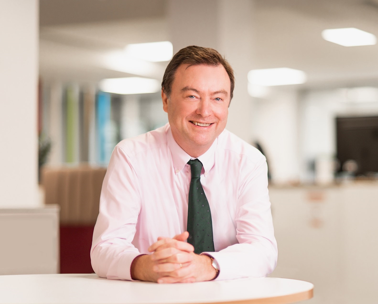 A photograph of Angus Flett, CEO of DCC